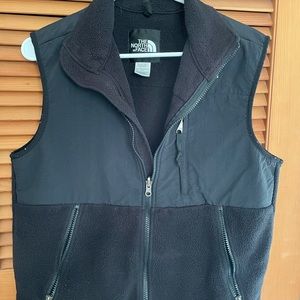 Black, women’s North Face fleece vest.